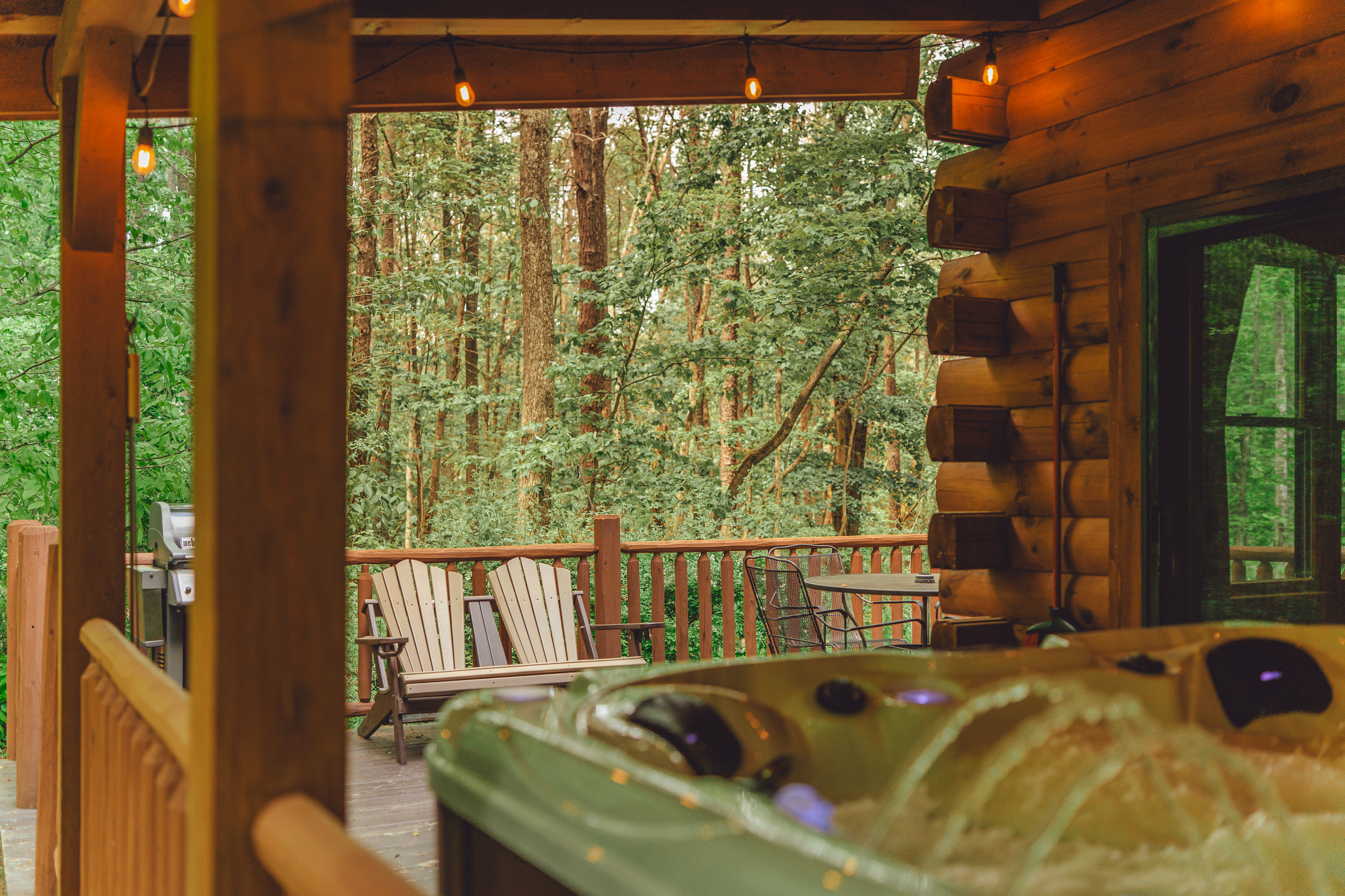 Private hot tub beneath the cabin’s covered deck